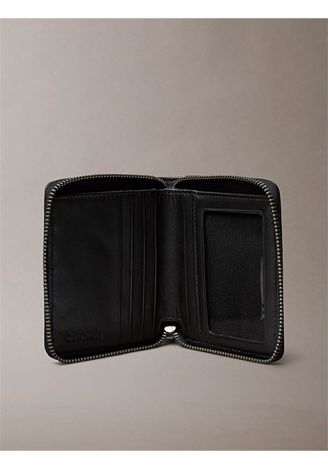Portafoglio a libro in pelle con zip CALVIN KLEIN | LV04D1077GUB1